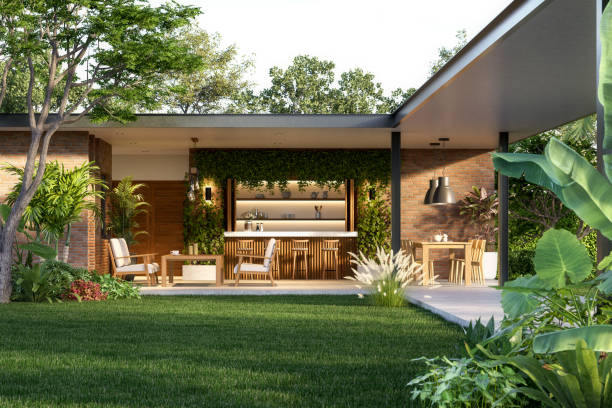 Modern contemporaty loft style house with green lawn 3d render surrounded by tropical nature, sunlight on the ground